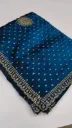 Teal blue stone-worked saree with golden mandallion motifs